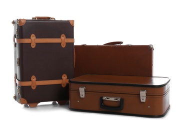 Photo of Set of classic suitcases on white background