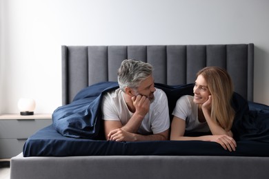 Photo of Lovely mature couple in bed at home