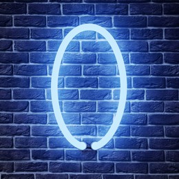 Image of Glowing neon number 0 sign on brick wall