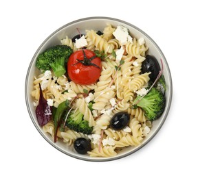 Bowl of delicious pasta with tomatoes, olives and broccoli on white background, top view