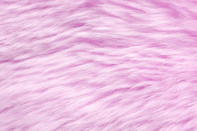 Texture of pink faux fur as background, closeup