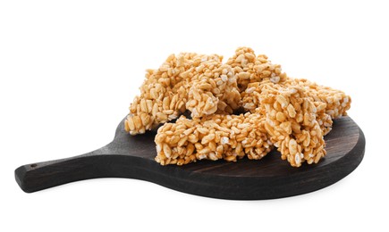 Photo of Wooden board with puffed rice bars (kozinaki) on white background