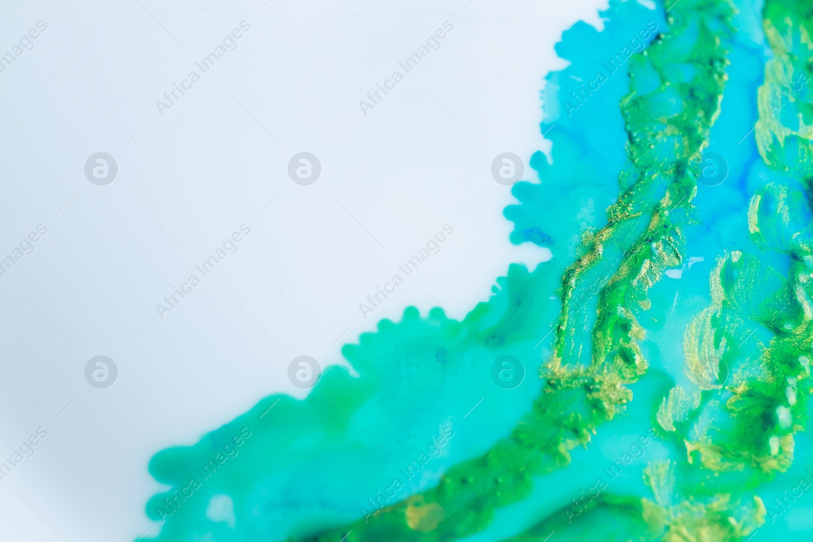 Photo of Beautiful abstract ink painting on white paper, closeup