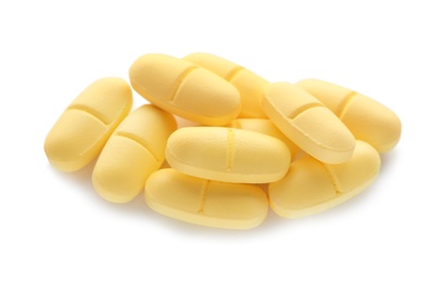 Photo of Pile of color pills on white background