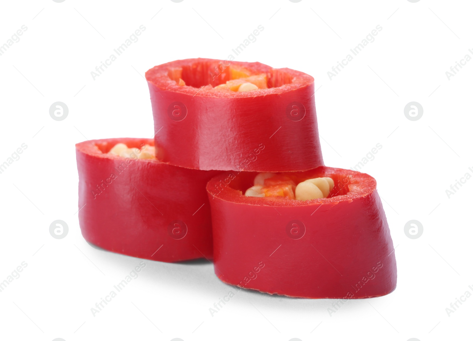 Photo of Slices of red chili pepper on white background