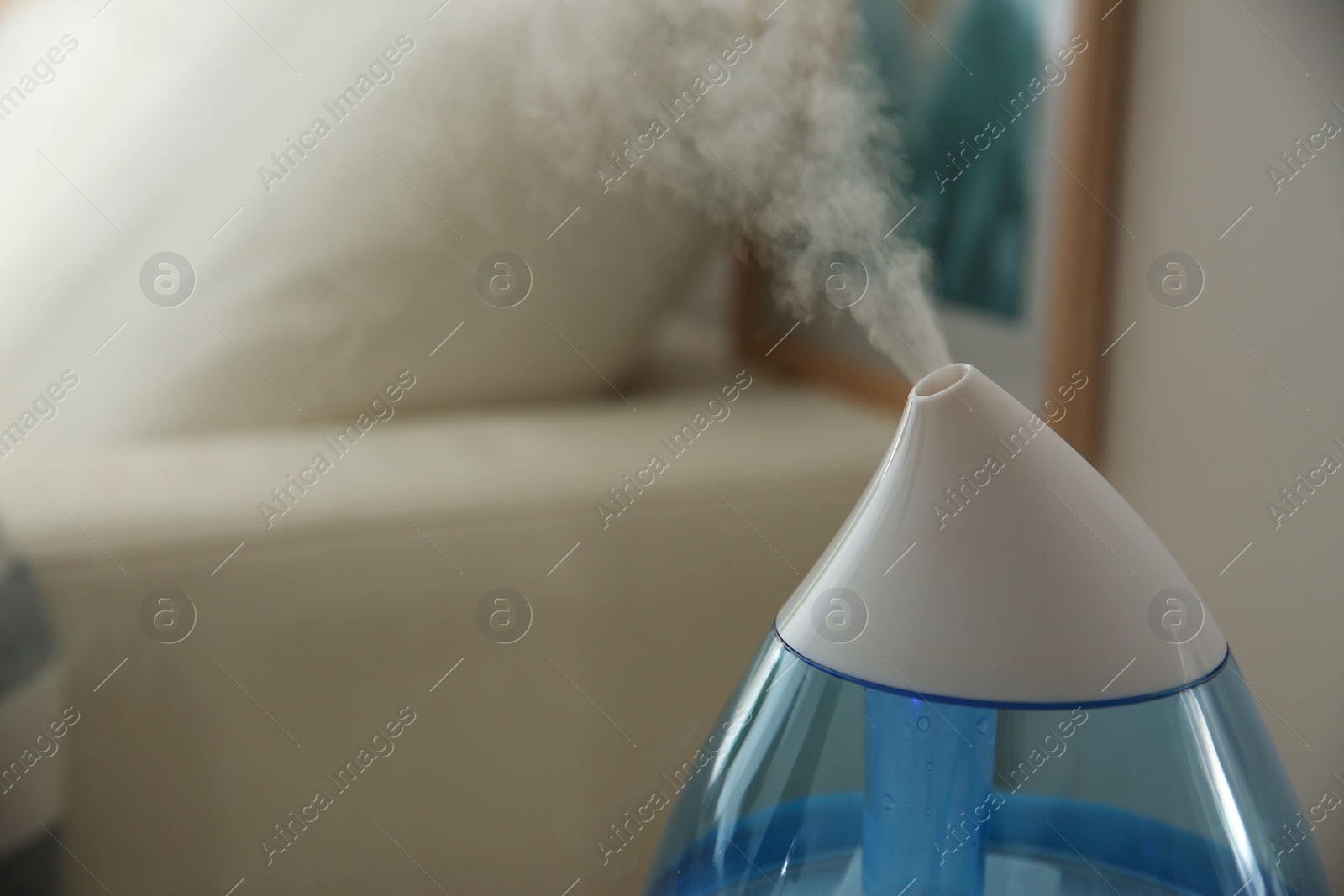 Photo of Modern humidifier indoors, closeup. Space for text