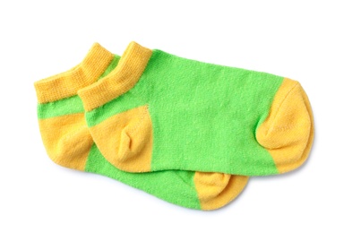 Photo of Cute child socks on white background, top view