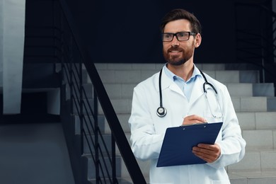 Photo of Doctor with stethoscope and clipboard in hospital