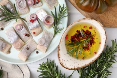 Tasty fish with spices, products and marinade on light table, flat lay