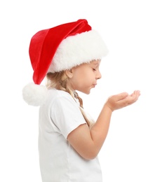 Photo of Cute little child wearing Santa hat on white background. Christmas holiday