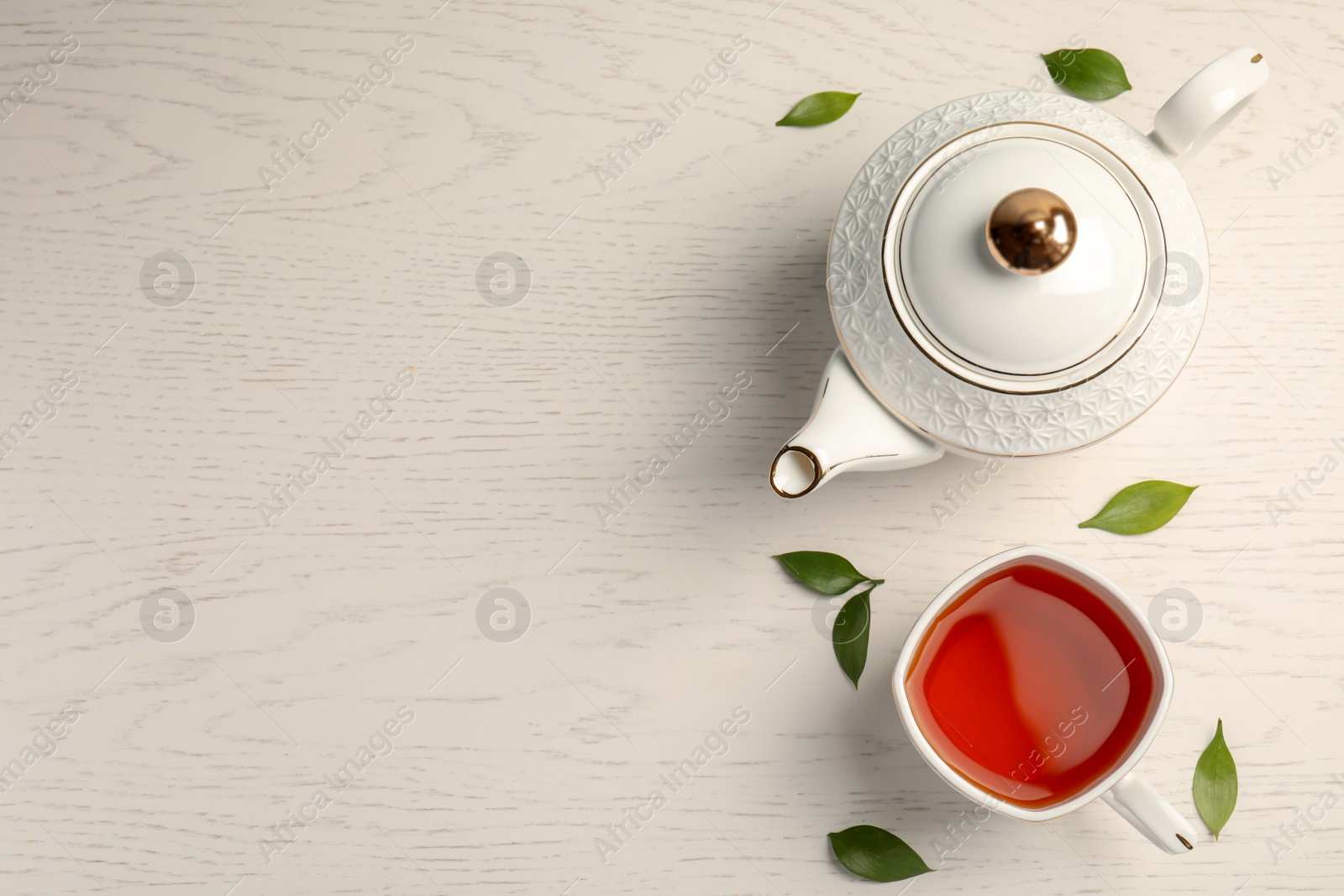 Photo of Flat lay composition with delicious tea on wooden background