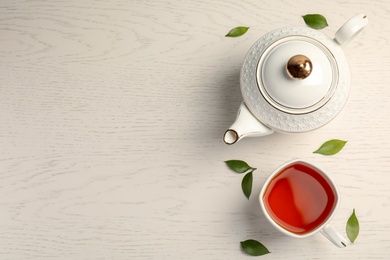 Photo of Flat lay composition with delicious tea on wooden background