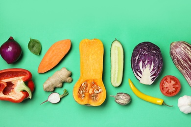 Photo of Flat lay composition with fresh ripe vegetables on color background