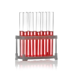 Photo of Test tubes with liquid samples in rack on white background. Chemistry glassware