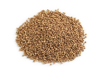 Heap of dried coriander seeds on white background, top view