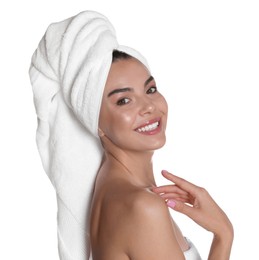 Beautiful young woman with towels on white background