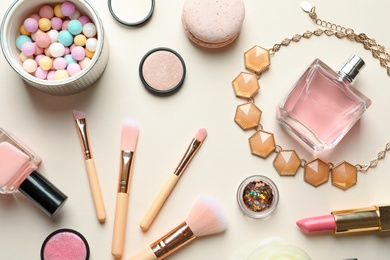 Photo of Flat lay composition with decorative cosmetics on color background