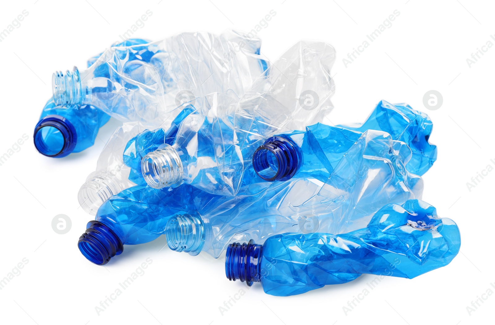 Photo of Crumpled disposable plastic bottles on white background