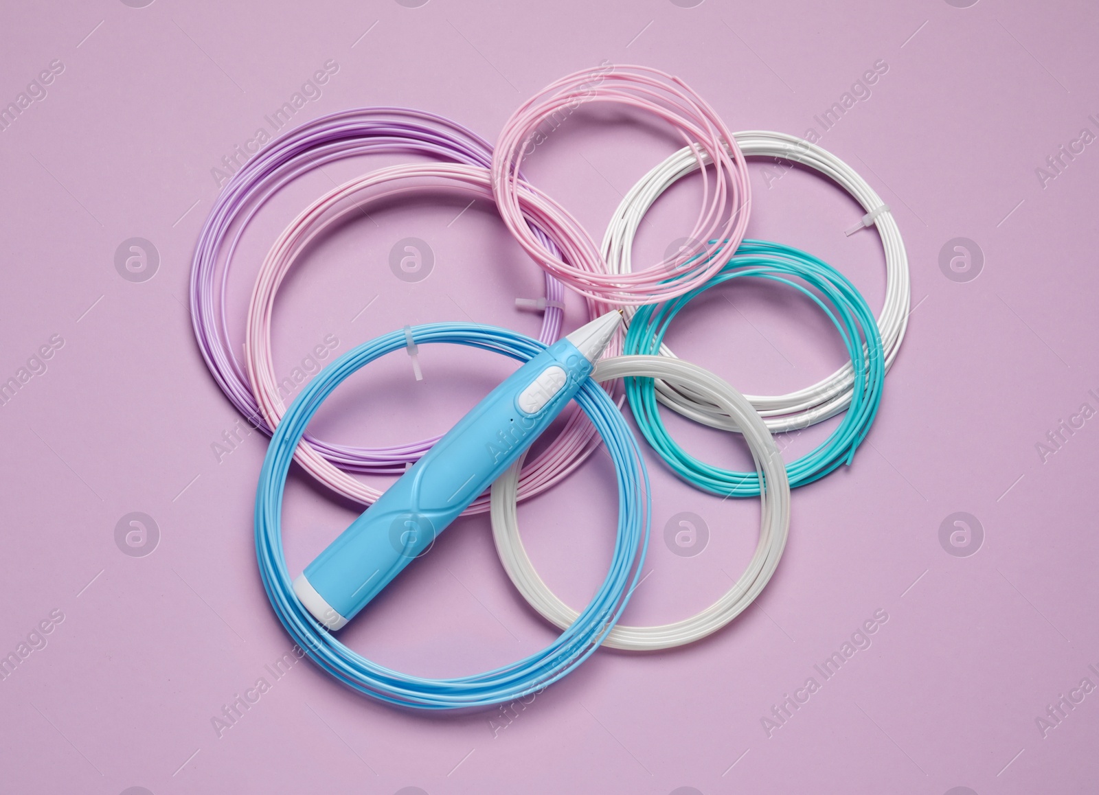 Photo of Stylish 3D pen and colorful plastic filaments on lilac background, flat lay