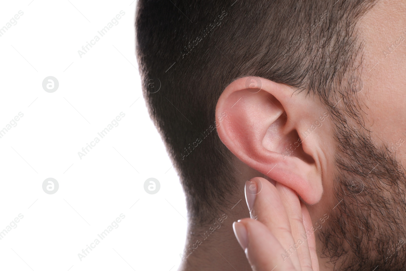 Photo of Man showing hand to ear gesture on white background, closeup