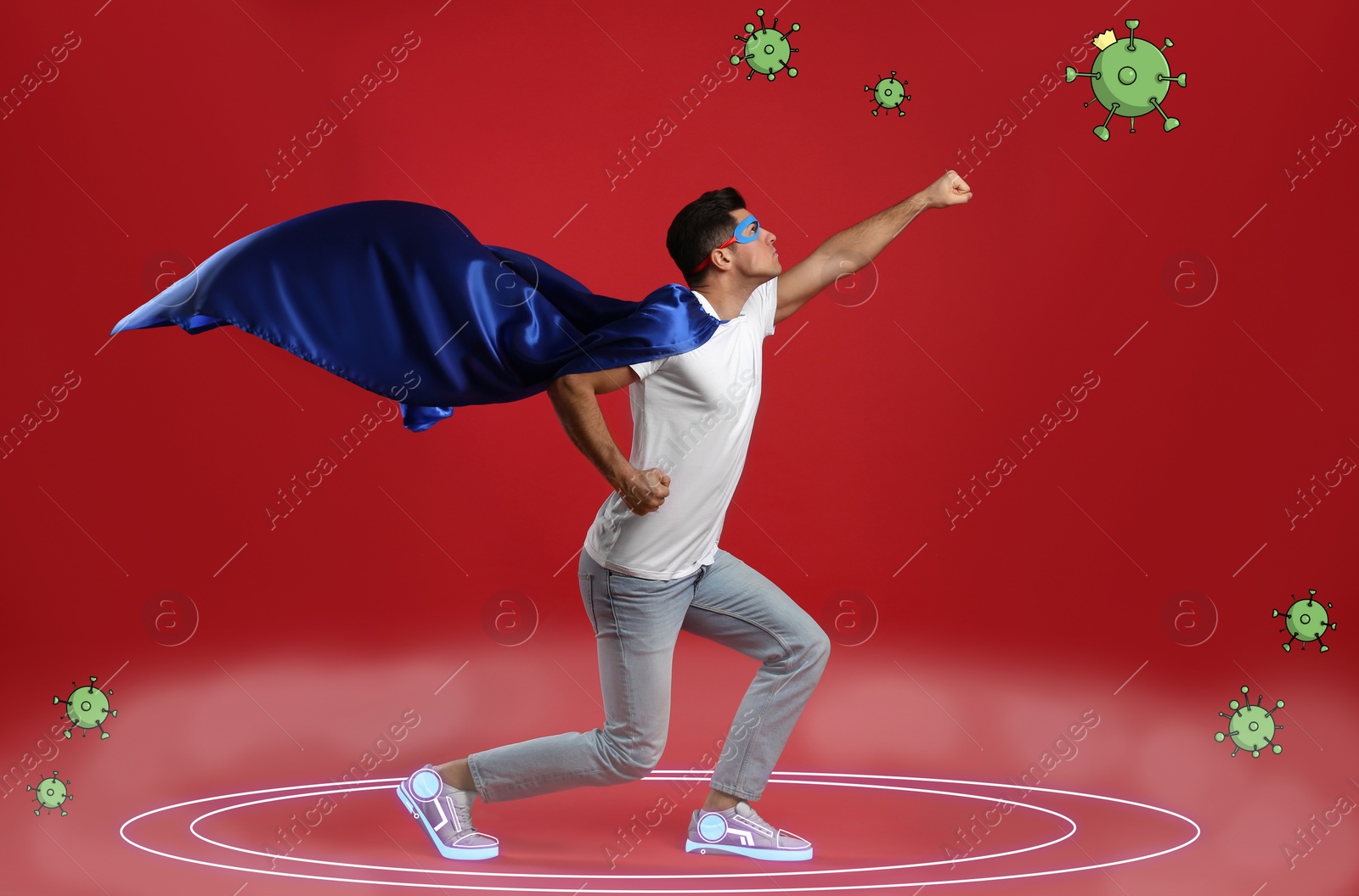 Image of Man wearing superhero costume fighting against viruses on red background