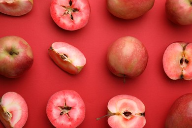 Photo of Tasty apples with red pulp on color background, flat lay