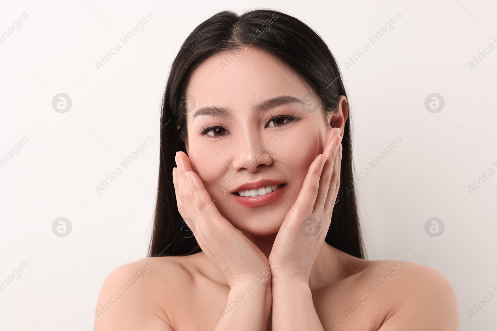 Photo of Portrait of beautiful woman on white background