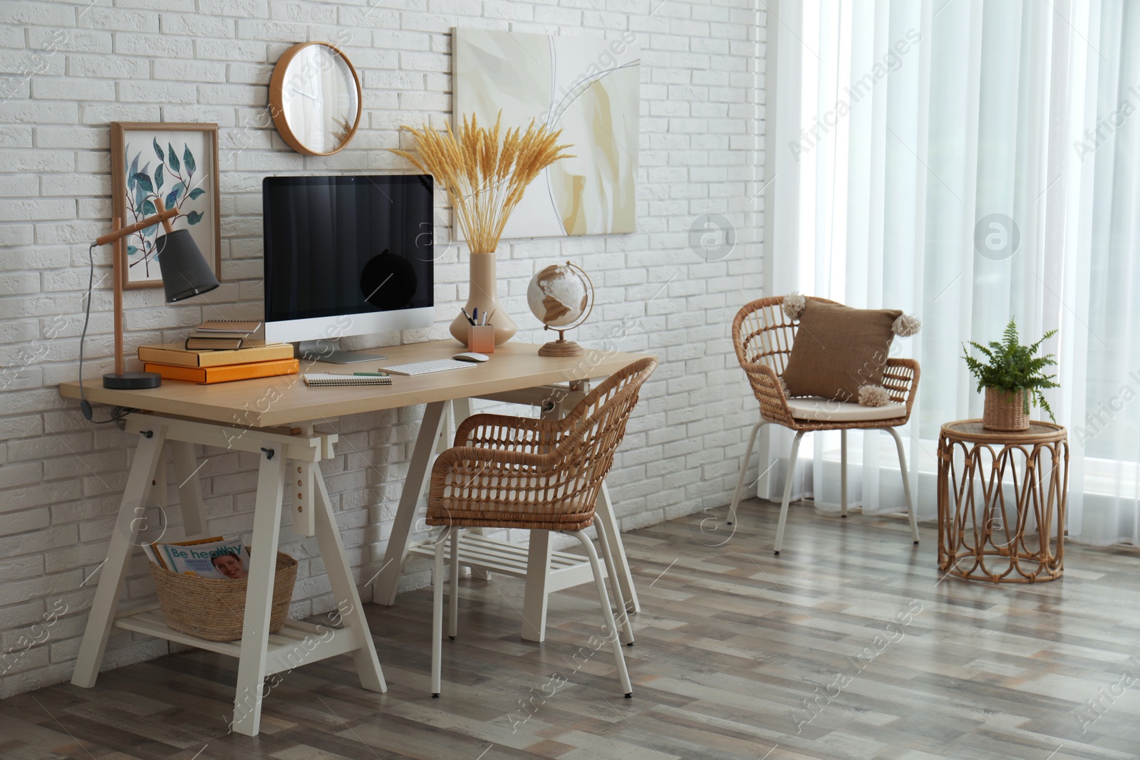 Photo of Stylish home office interior with comfortable workplace near white brick wall