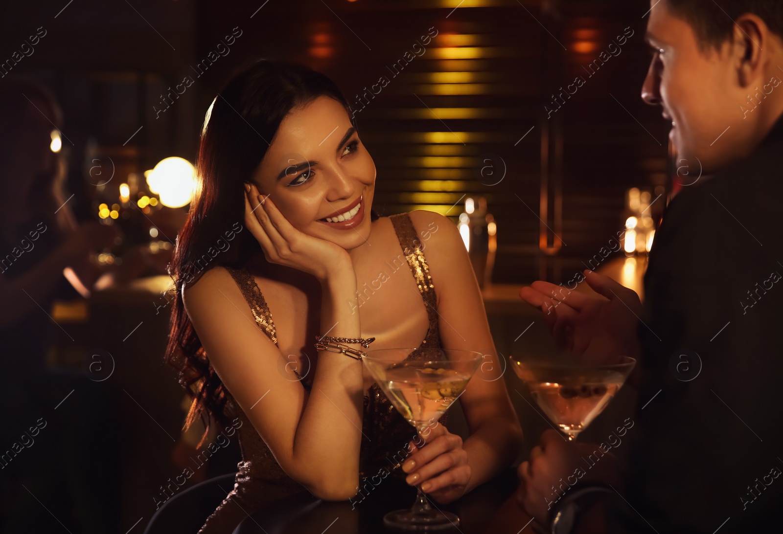 Photo of Man and woman flirting with each other in bar