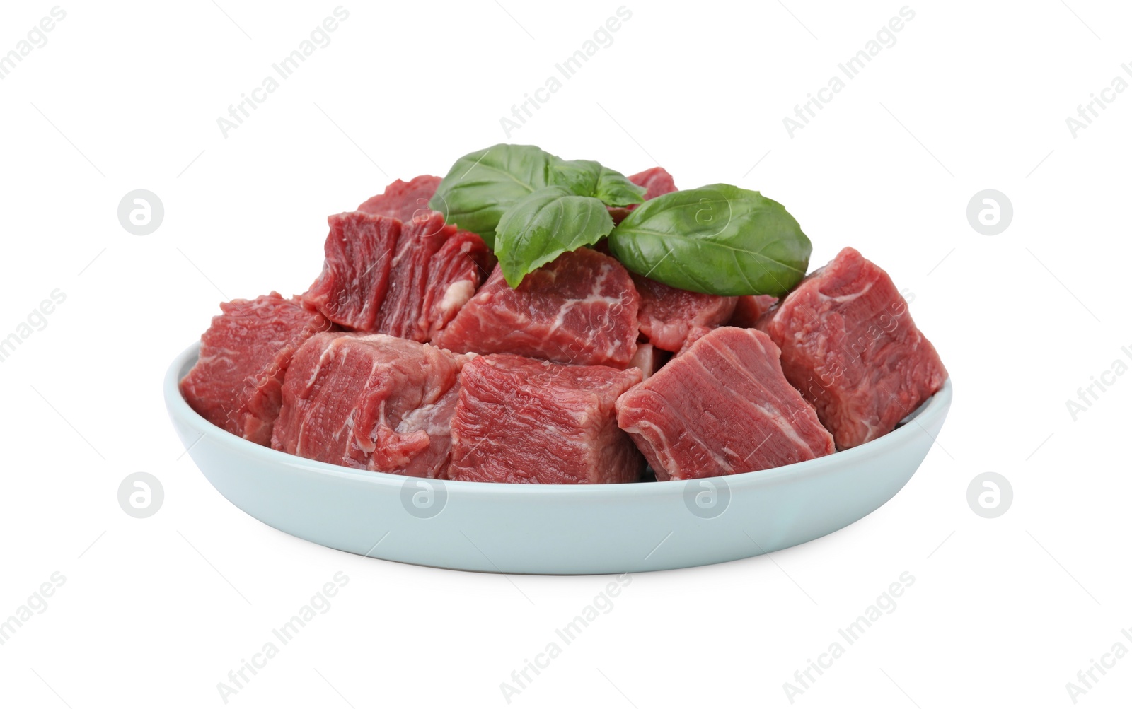 Photo of Fresh raw cut beef with basil leaves isolated on white