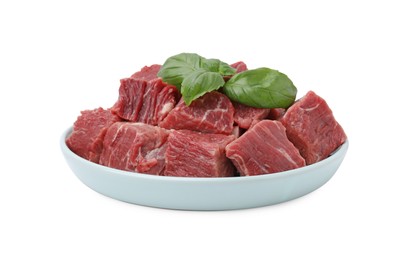 Fresh raw cut beef with basil leaves isolated on white