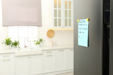 Photo of To do list on fridge in kitchen. Space for text