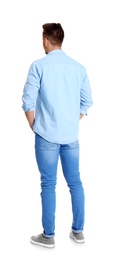 Photo of Young man in stylish jeans on white background