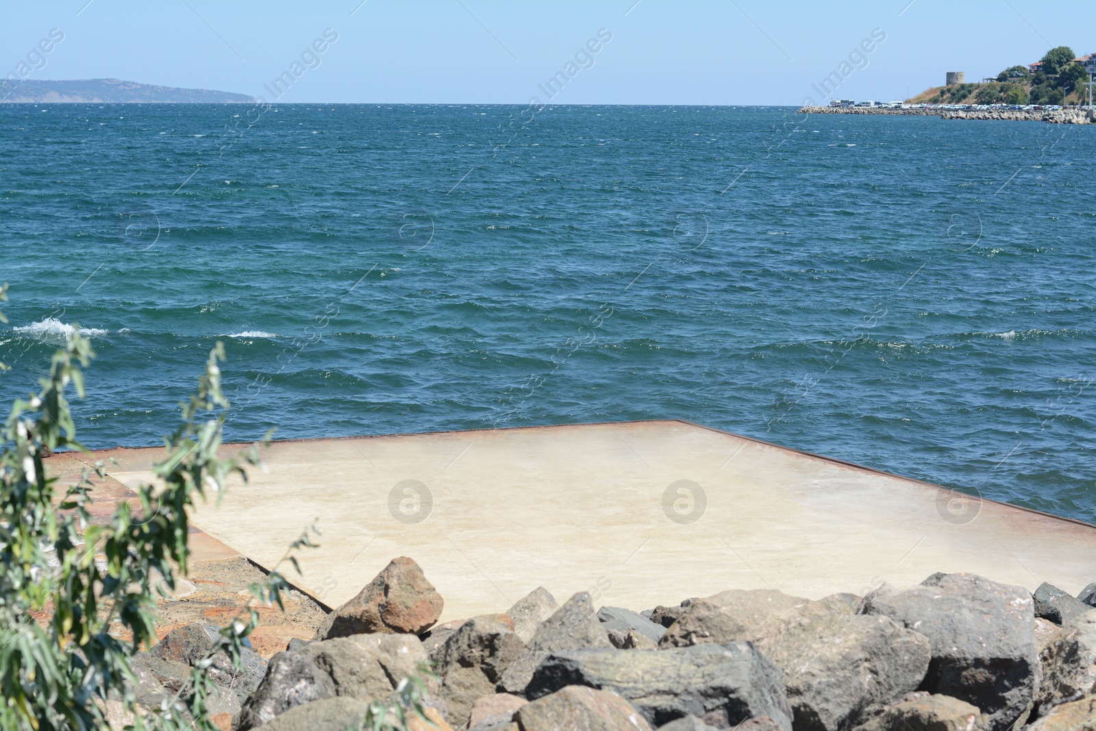 Photo of Beautiful seascape with concrete pier on sunny day