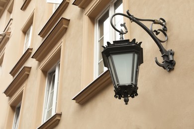 Vintage street lamp on wall of building