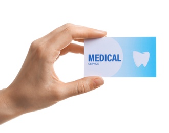 Woman holding business card isolated on white, closeup. Dental medical service