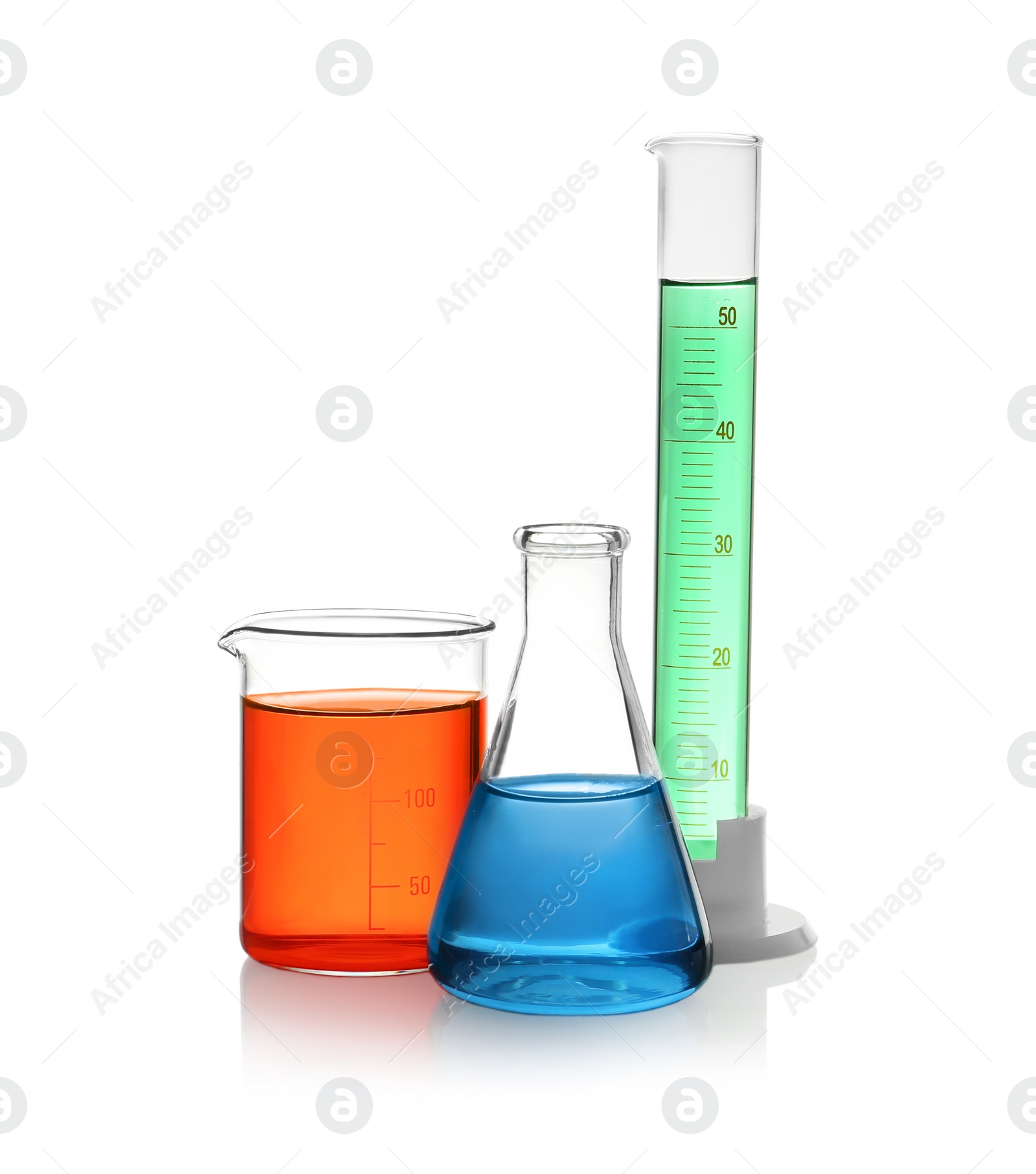 Photo of Laboratory glassware with colorful liquids on white background