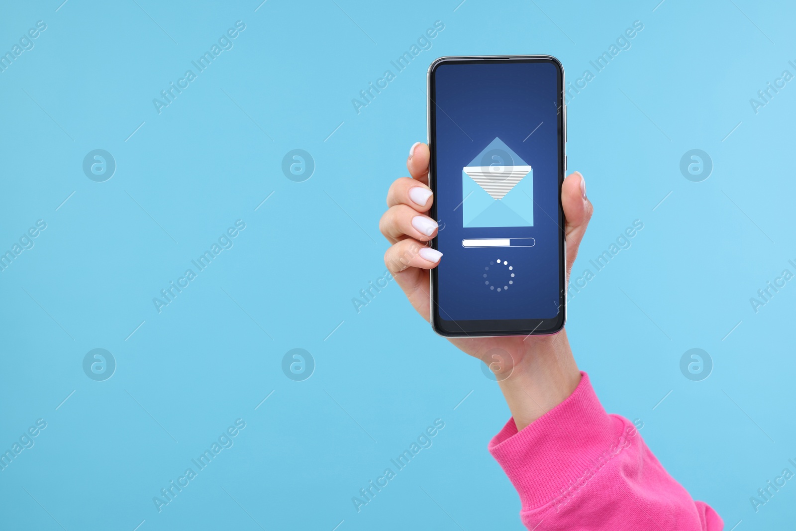 Image of Got new message. Woman holding smartphone on light blue background, closeup. Space for text