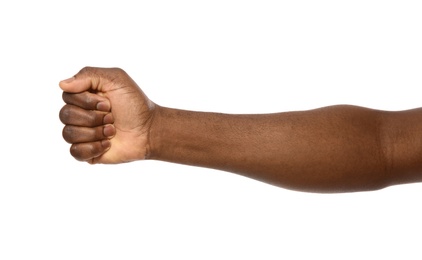 African-American man showing fist on white background, closeup