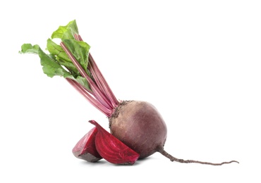 Photo of Whole and cut red beets on white background