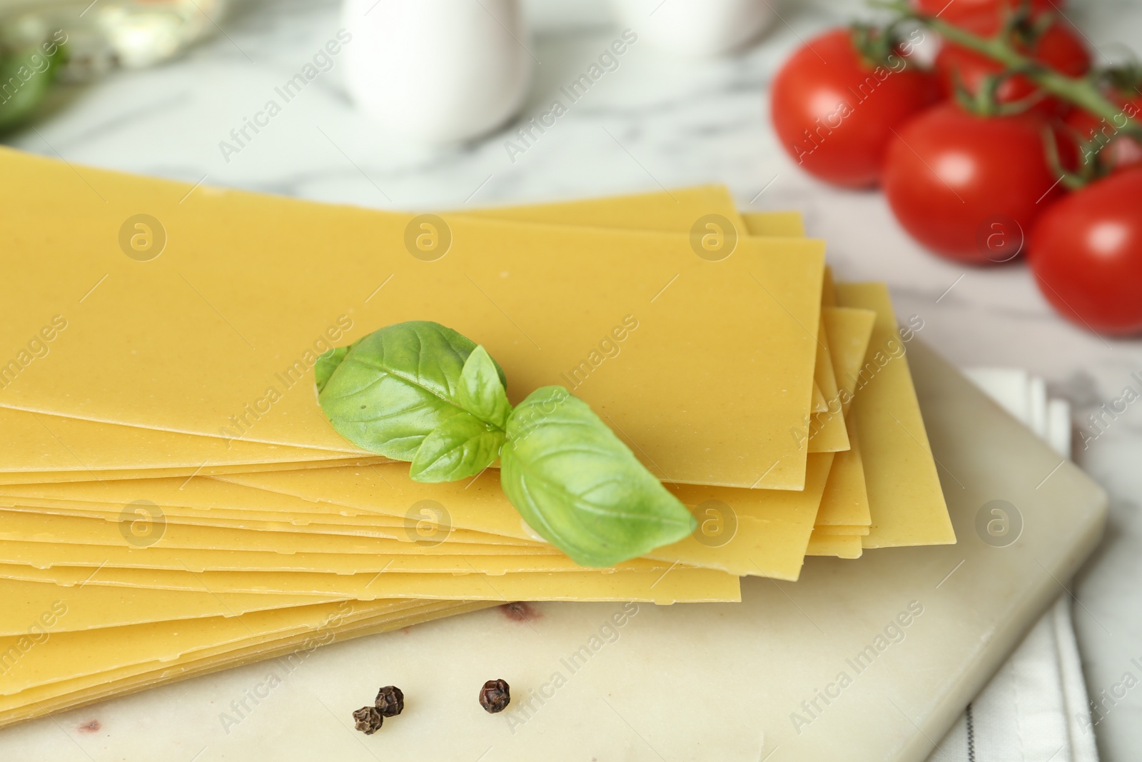 Photo of Composition with uncooked lasagna sheets on table, closeup