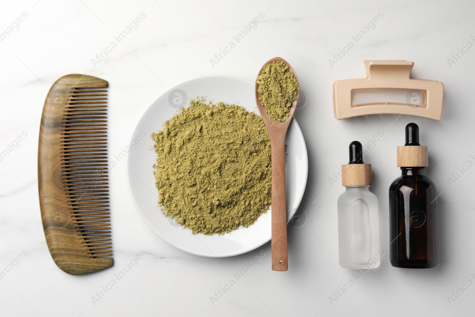 Photo of Flat lay composition with henna powder and comb on white marble table. Hair care products