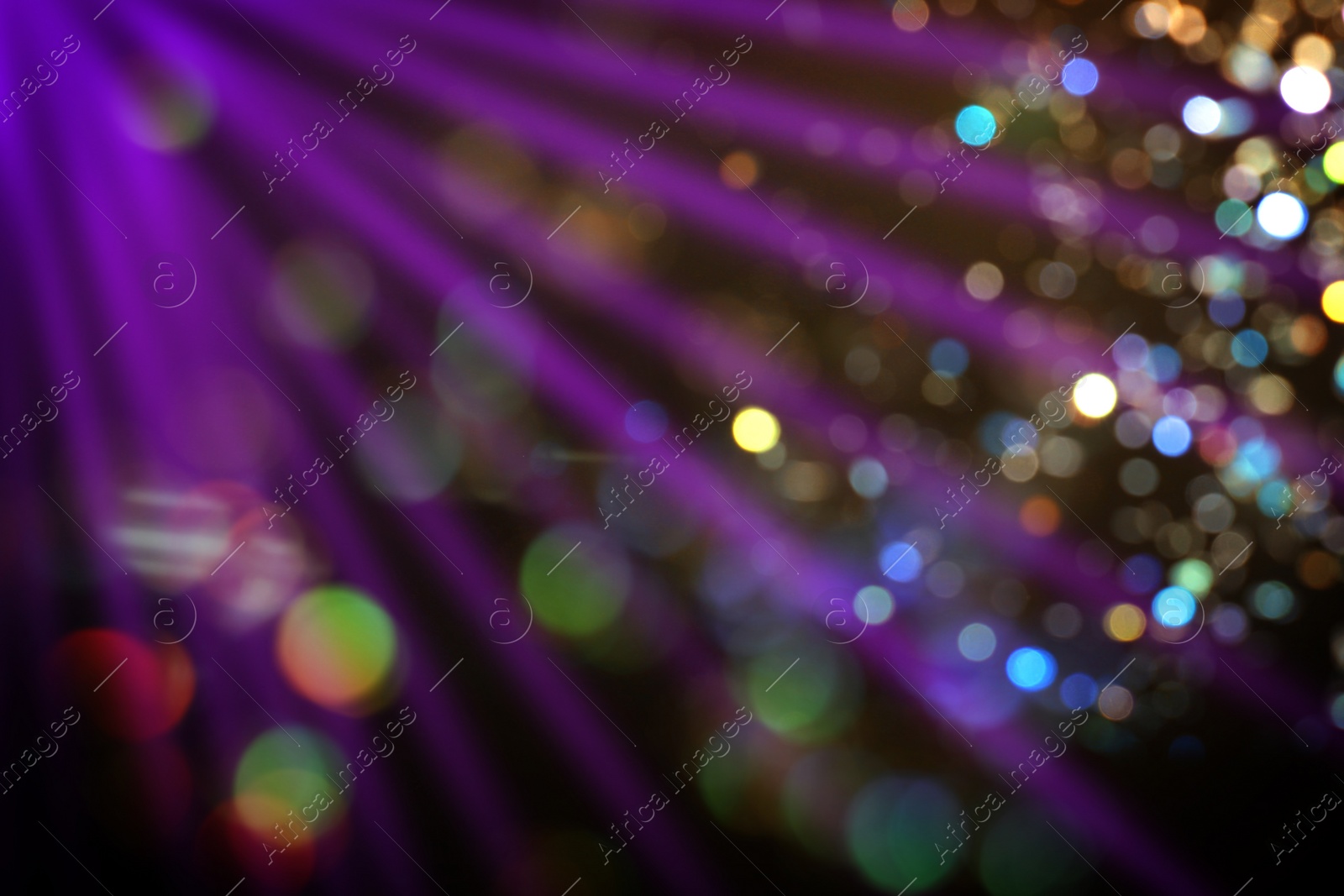 Image of Beams of light in darkness of night club, bokeh effect