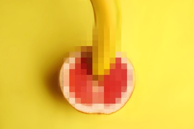 Image of Fresh grapefruit and banana on yellow background, top view. Sex concept