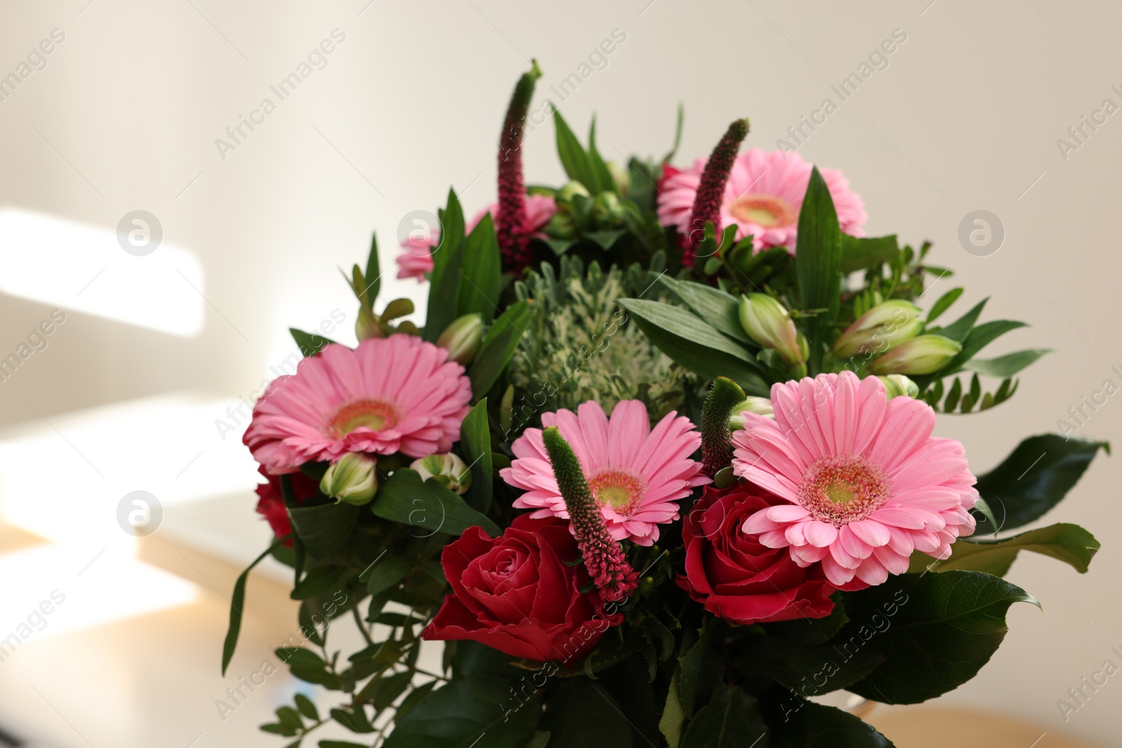 Photo of Bouquet of beautiful flowers on blurred background, closeup