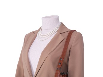 Photo of Female mannequin dressed in jacket and turtleneck with accessories isolated on white. Stylish outfit