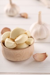 Fresh garlic on white wooden table, closeup