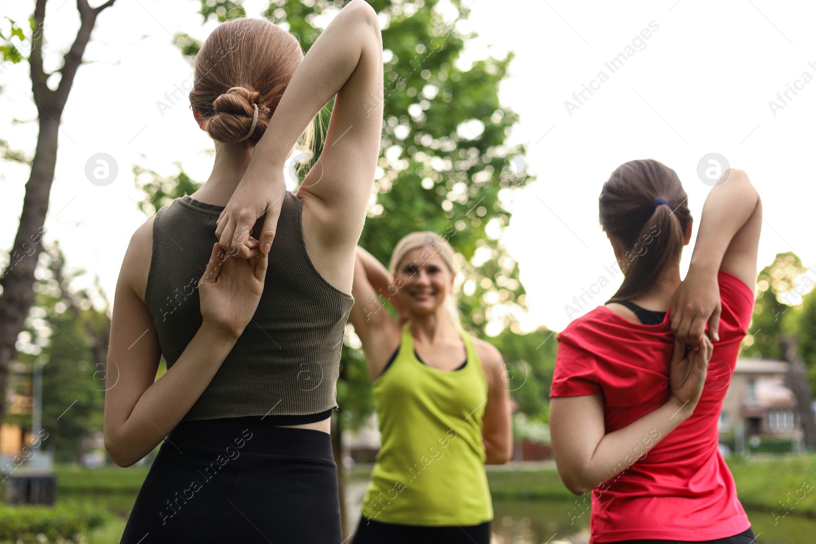 Photo of Women doing morning exercise together in park