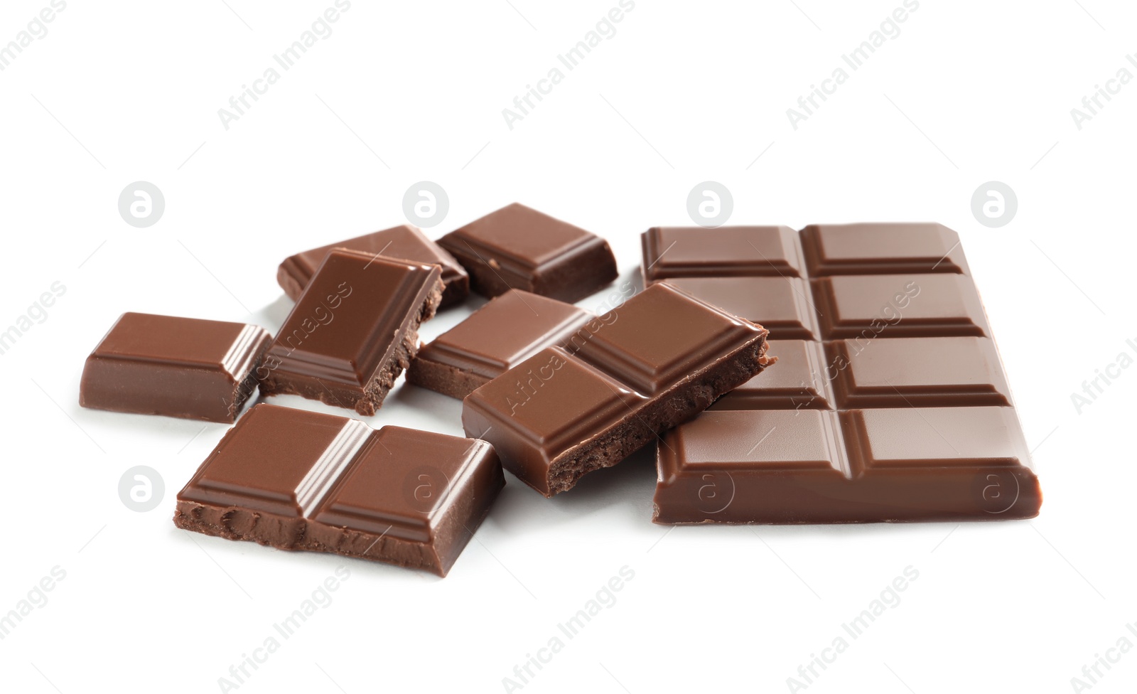 Photo of Pieces of tasty milk chocolate on white background