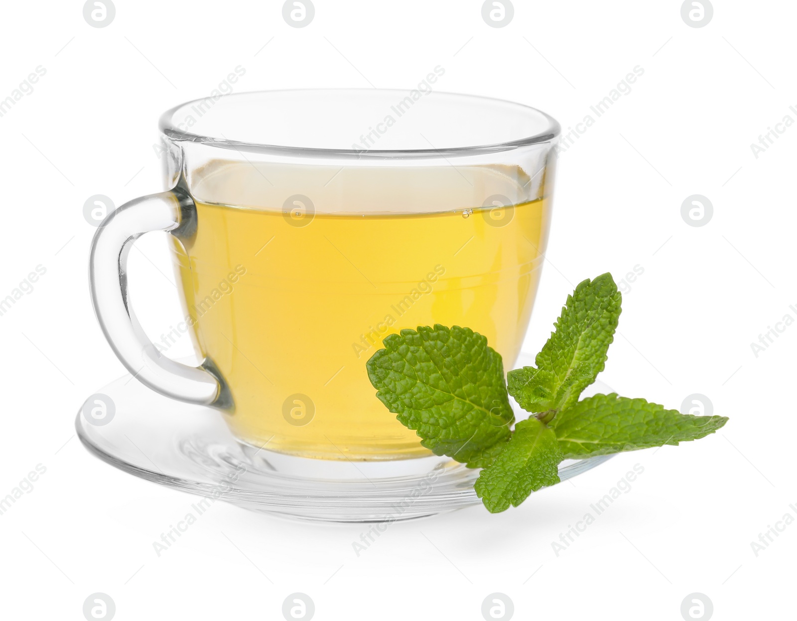 Photo of Fresh green tea in glass cup, mint and saucer isolated on white